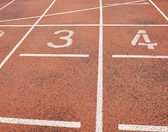 Close-up of the lane numbers on an outdoor running track