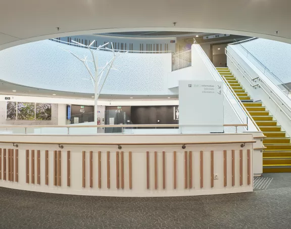 Hospital corridor with a modern winding staircase