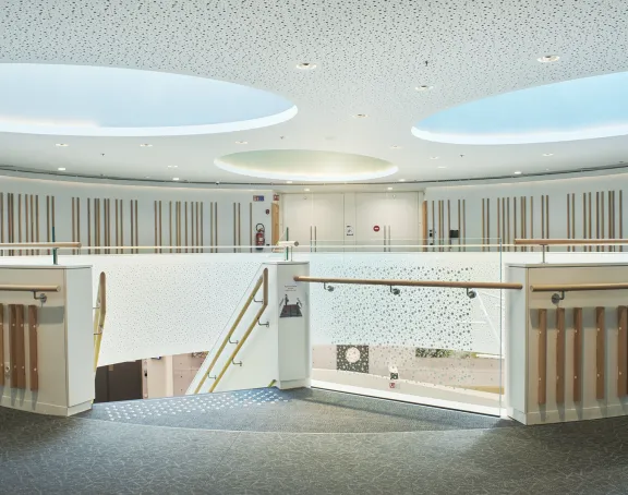 Hospital corridor with a modern winding staircase