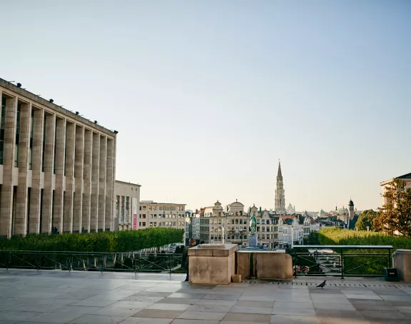 Scenic shot of the Mont des Arts gardens in Brussels, with the city skyline in the background