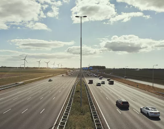 Freeway cars wind turbines