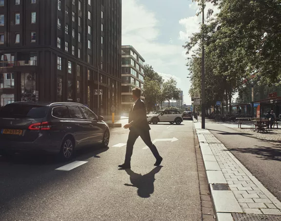 Amsterdam Zuidas man walking car