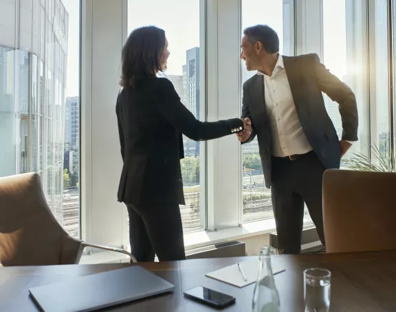 Business meeting man woman handshake