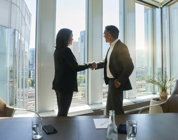 Business meeting man woman handshake