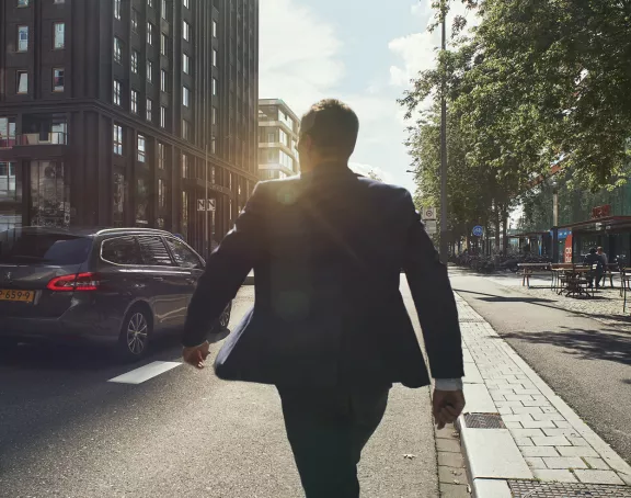 Amsterdam Zuidas business man on street