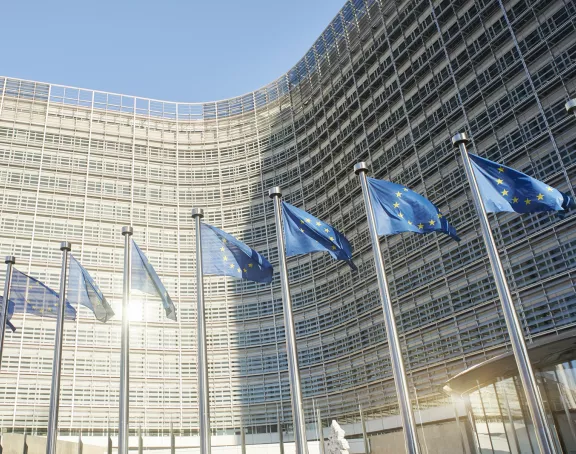 Flags waving in front of the EU building in Brussels