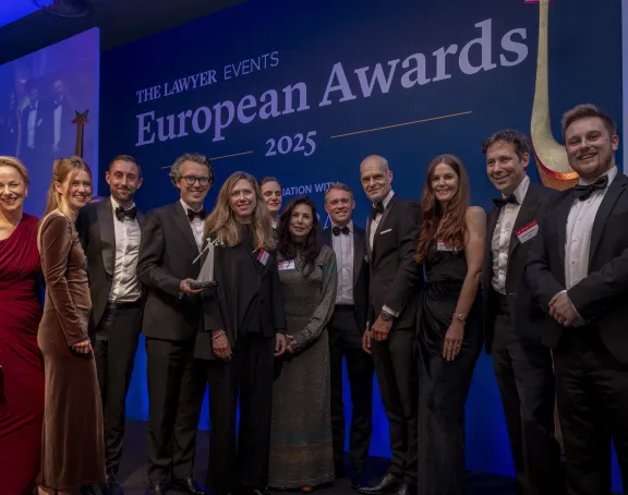 Stibbe delegation holding award for 'Law Firm of the Year: Benelux' at The Lawyer European Awards 2025