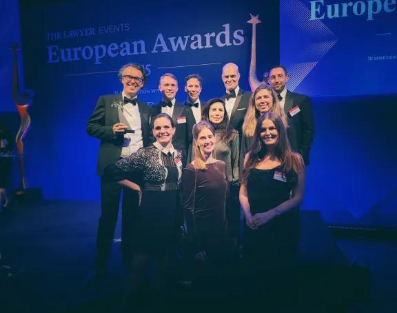 Stibbe delegation holding award for 'Law Firm of the Year: Benelux' at The Lawyer European Awards 2025