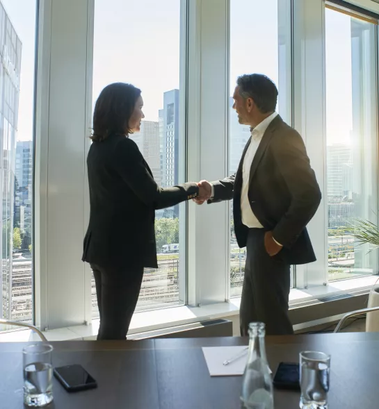 Business meeting man woman handshake