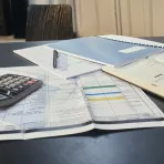 Desk with papers and calculator