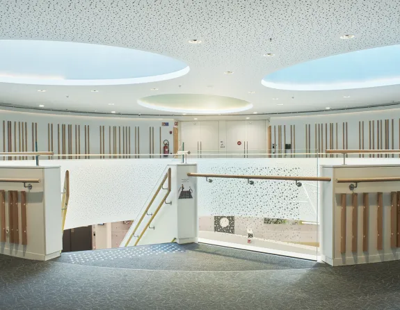 Hospital corridor with a modern winding staircase