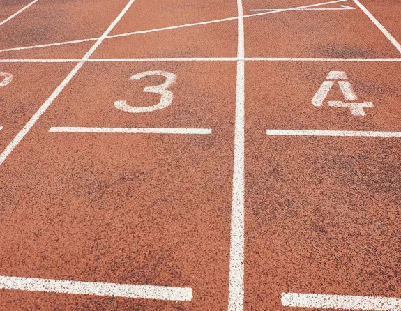 Close-up of the lane numbers on an outdoor running track