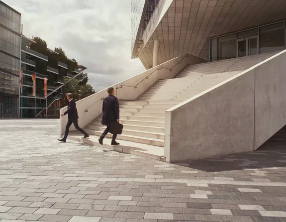 Business people walking up stairs