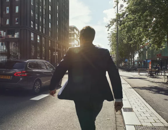 Amsterdam Zuidas business man on street