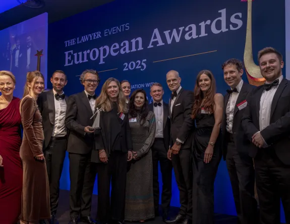 Stibbe delegation holding award for 'Law Firm of the Year: Benelux' at The Lawyer European Awards 2025