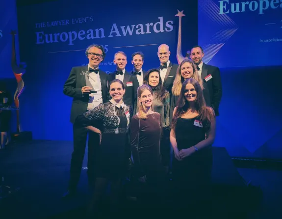 Stibbe delegation holding award for 'Law Firm of the Year: Benelux' at The Lawyer European Awards 2025