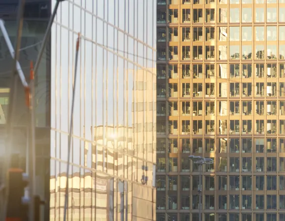 “High-rise office building with reflective glass panels and a modern, professional appearance